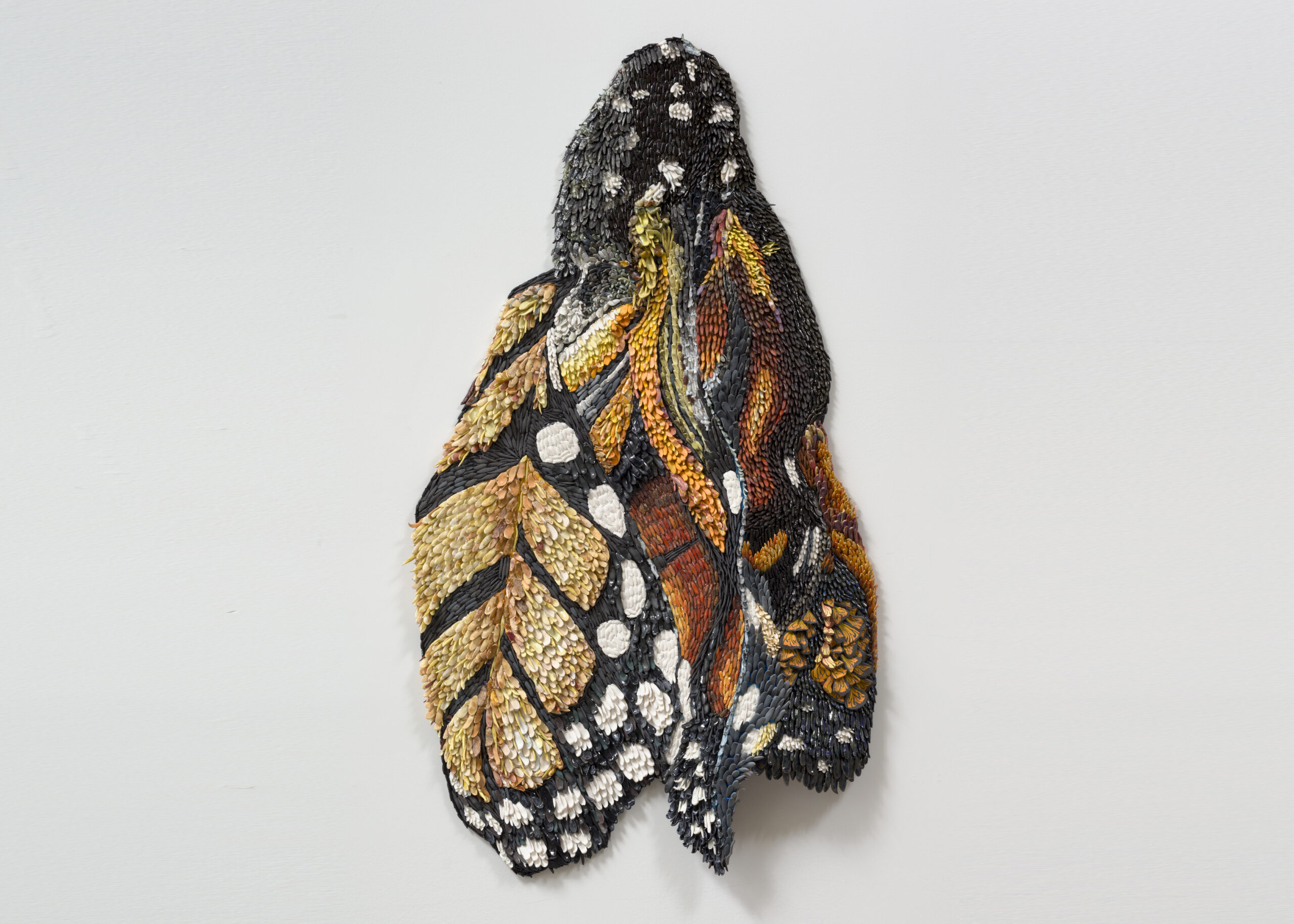 Rebecca Manson<br><em>Emerging Monarch</em>, 2025<br>Porcelain, glaze, adhesives, canvas, hardware<br>43 x 24 inches / 109.2 x 61 cm