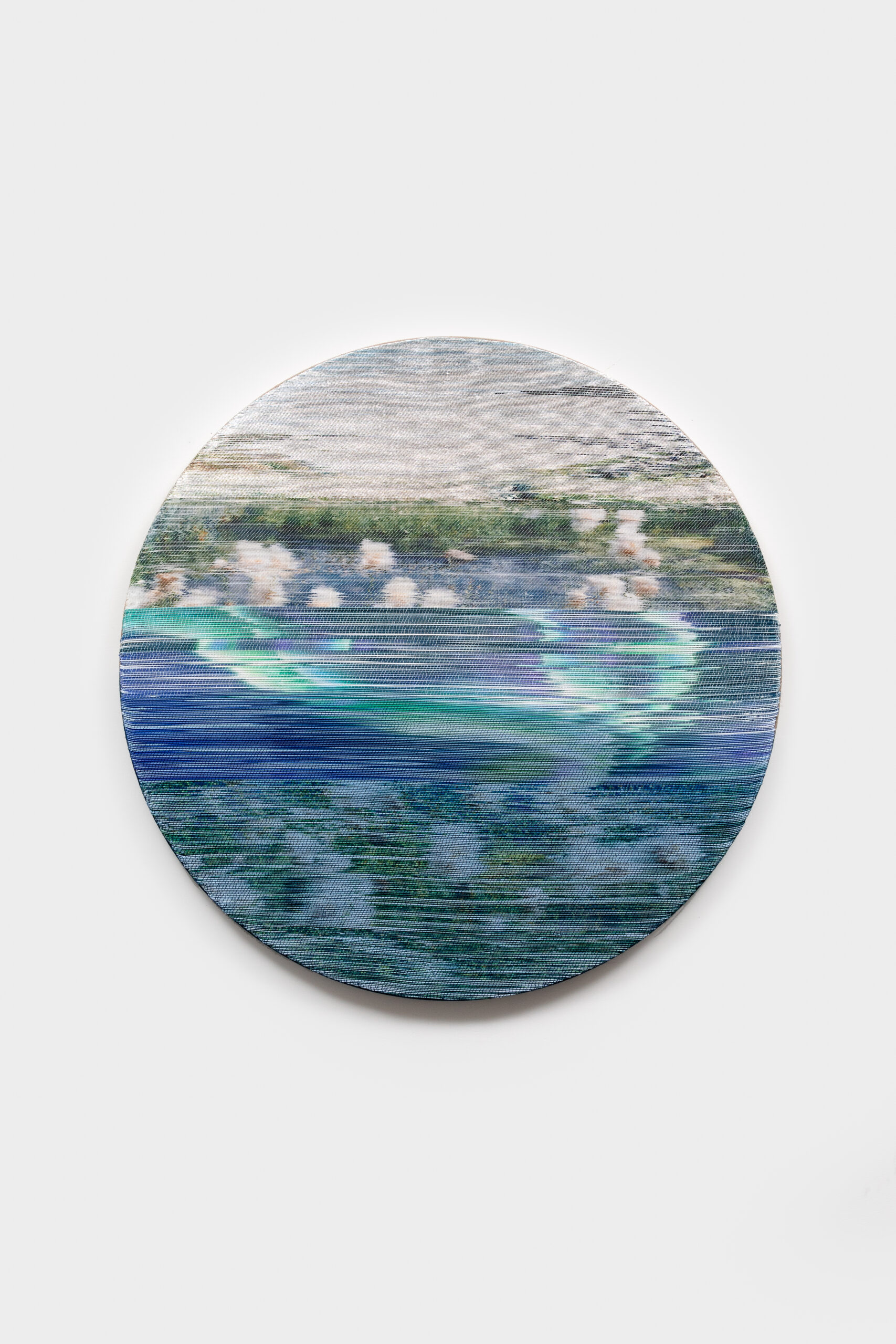 Margo Wolowiec<br><em>Aurora</em>, 2025<br>Handwoven polymer, linen, sterling silver-leafed thread, indigo, dye sublimation ink, mounted on indigo dyed hemp support<br>40 x 40 x 2 inches / 101.6 x 101.6 x 5.1 cm