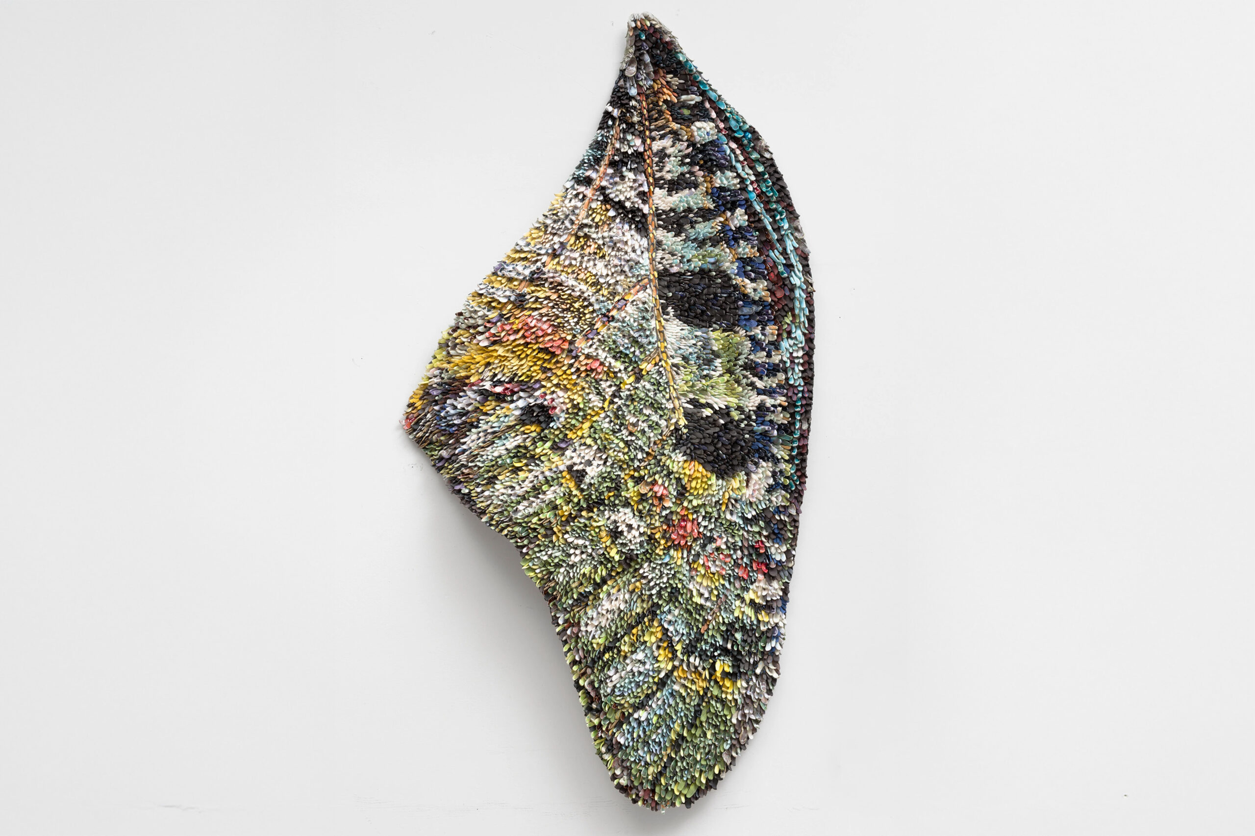 Rebecca Manson<br><em>Yellow Lisa</em>, 2025<br>Porcelain, glaze, adhesives, canvas, hardware<br>55 x 30 x 2 inches / 139.7 x 76.2 x 5.1 cm