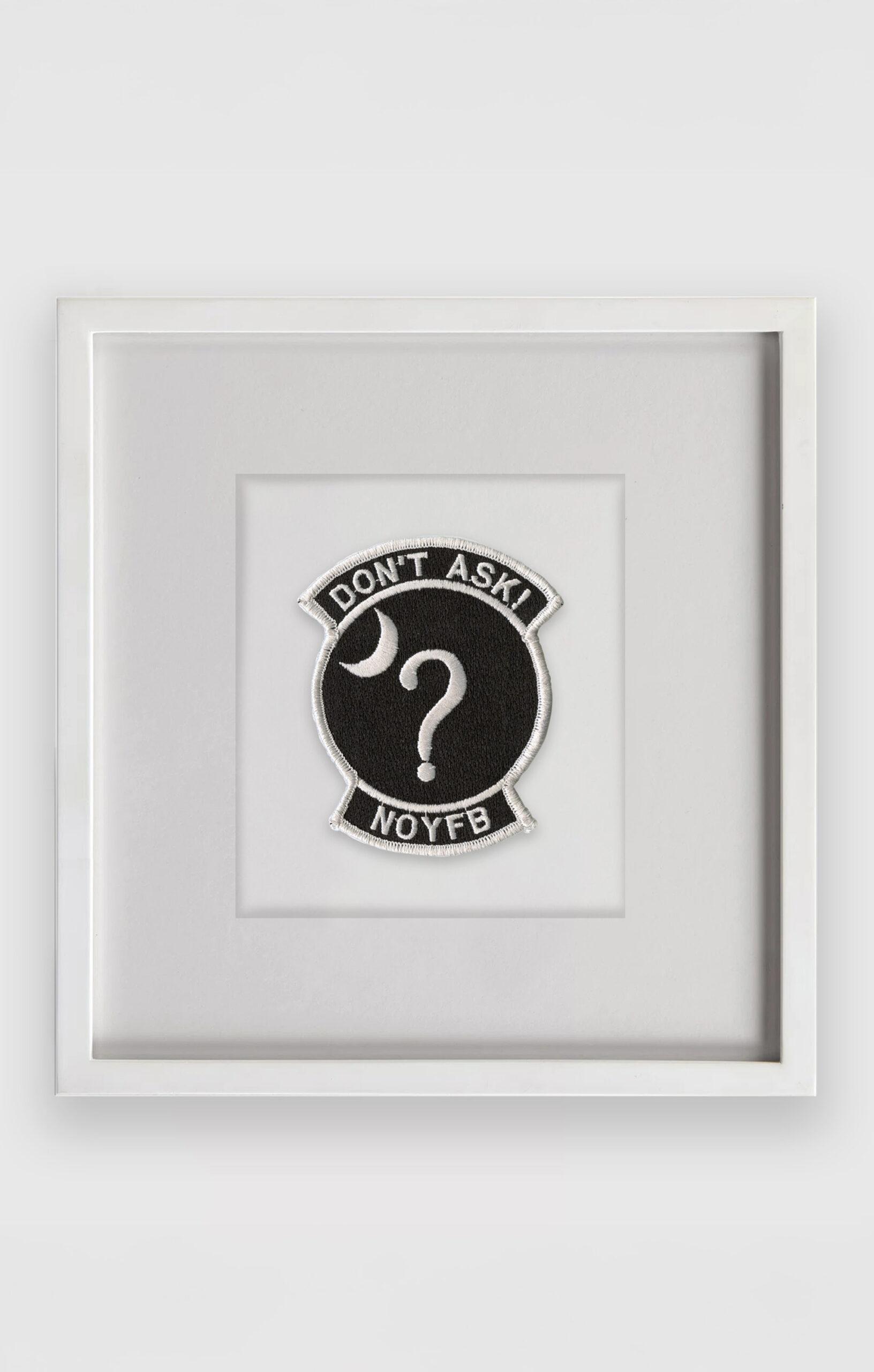 Trevor Paglen<br><em>NOYFB</em>, 2006<br>Fabric patch<br>11 5/8 x 11 5/8 x 1 1/2 inches / 29.4 x 29.4 x 3.8 cm<br>Edition of 50 plus 2 artist’s proofs