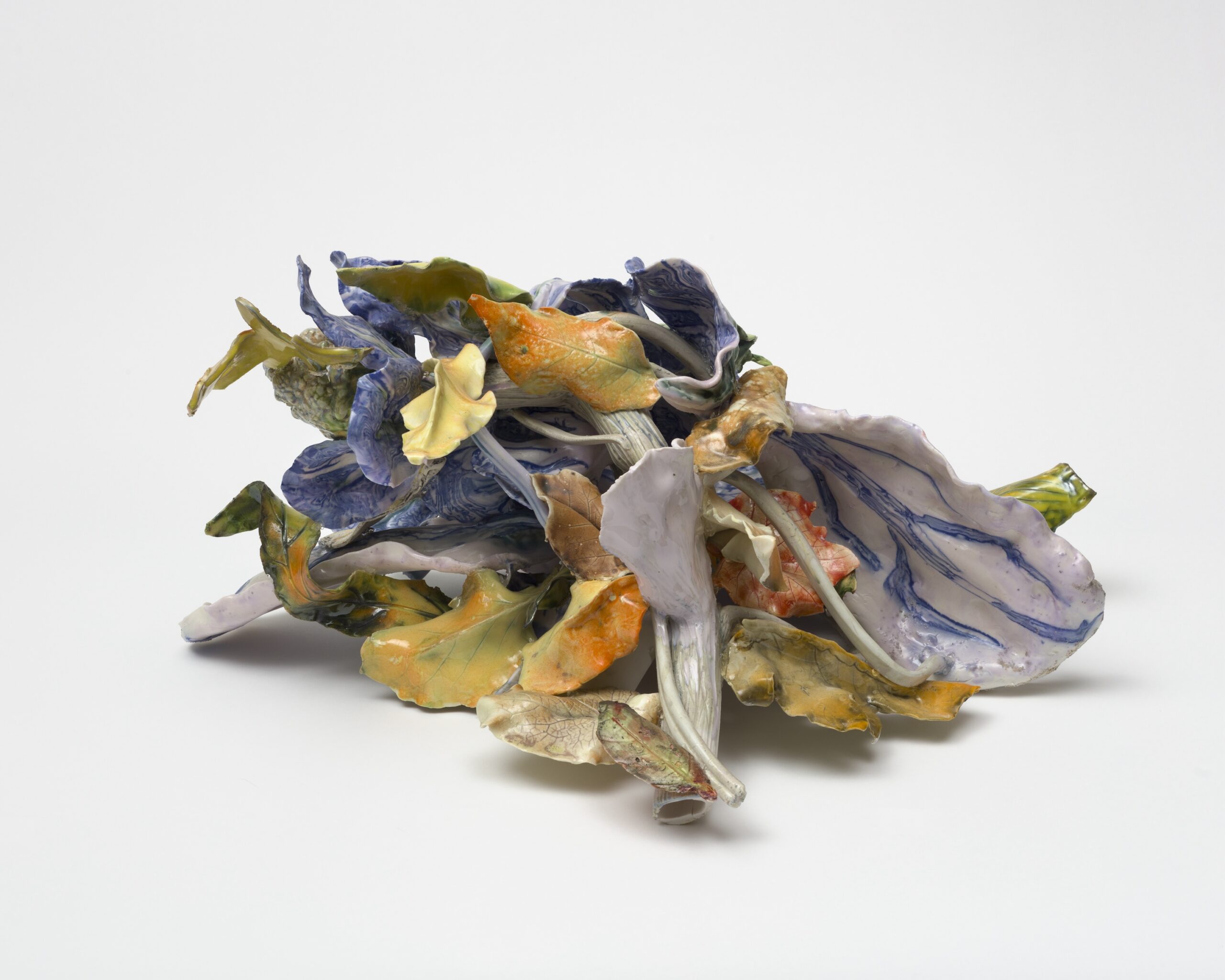 Rebecca Manson<br><em>Savoy Head</em>, 2025<br>Porcelain, glaze, cobalt, and adhesives<br>14 x 28 x 24 inches / 35.6 x 71.1 x 61 cm