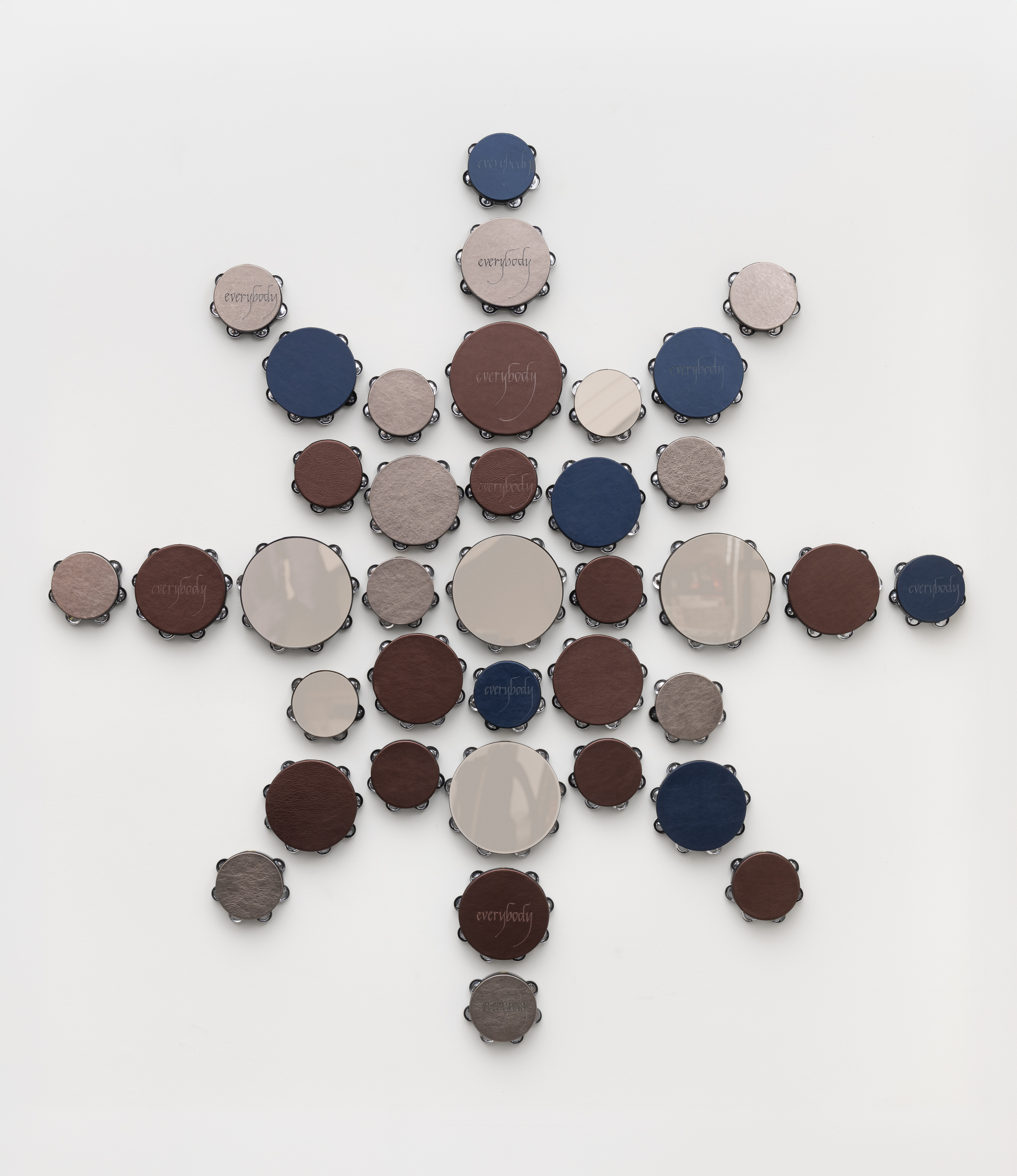 Lava Thomas<br><em>Everybody Is a Star</em>, 2026<br>Altered tambourines, metallic bronze, pewter, and navy leather with acrylic mirrored pewter<br>80 x 80 x 2 inches / 203.2 x 203.2 x 5.1 cm