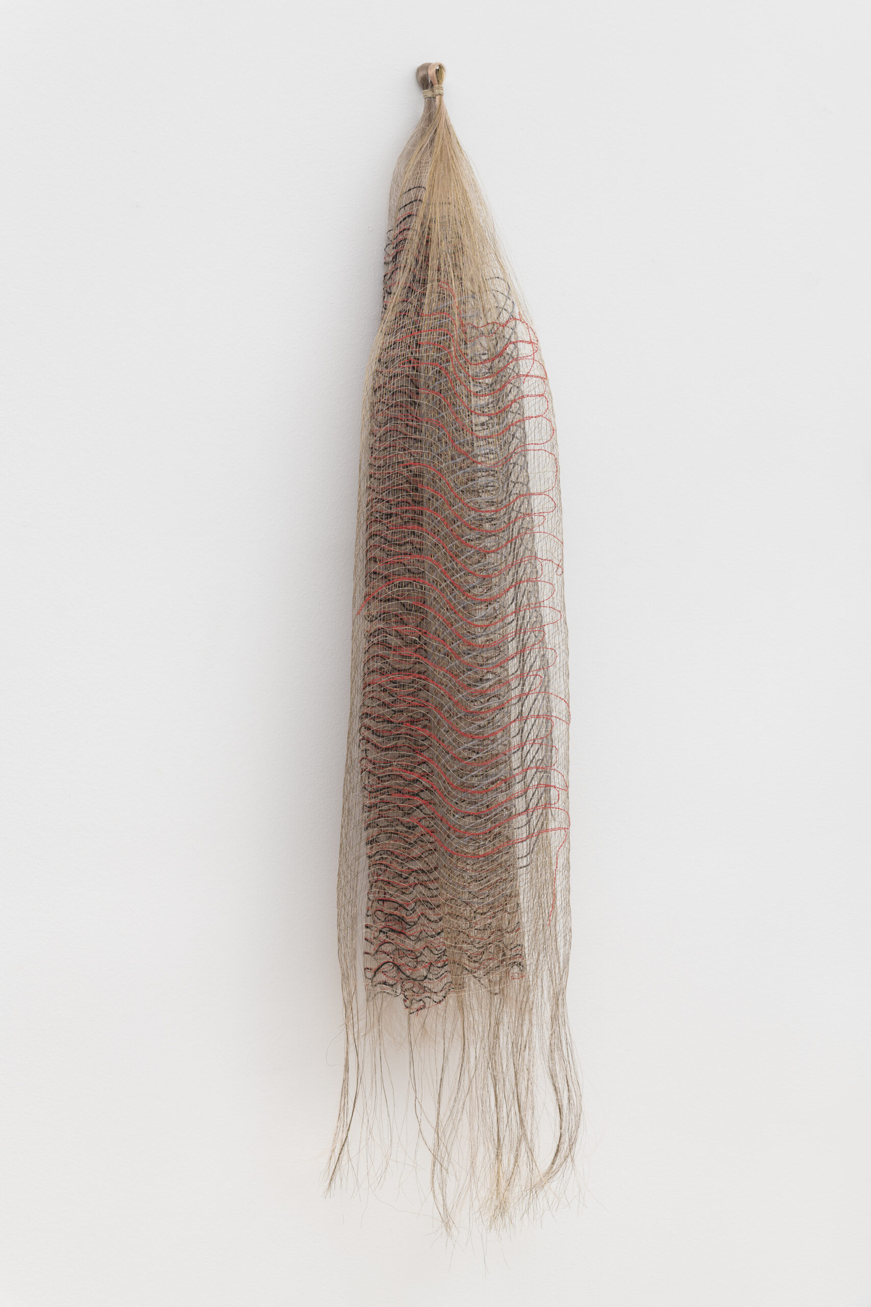 Michelle Yi Martin<br><em>Sundown</em>, 2026<br>Metallic thread, monofilament, nettle, and wool<br>51 x 10 x 6 inches / 129.5 x 25.4 x 15.2 cm