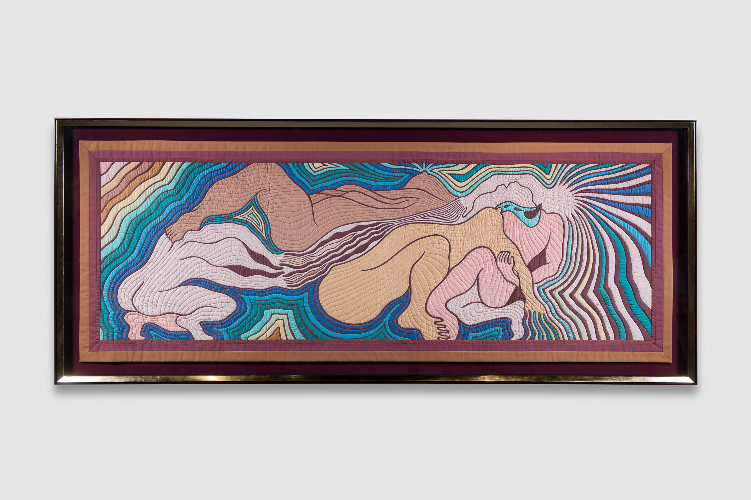 <p>Judy Chicago<br /><em>Birth Trinity Quilt 1</em>, 1983<br />Quilting and reverse appliqué<br />56 3/4 x 136 3/4 x 3 3/4 inches / 144.1 x 347.3 x 9.5 cm</p>
