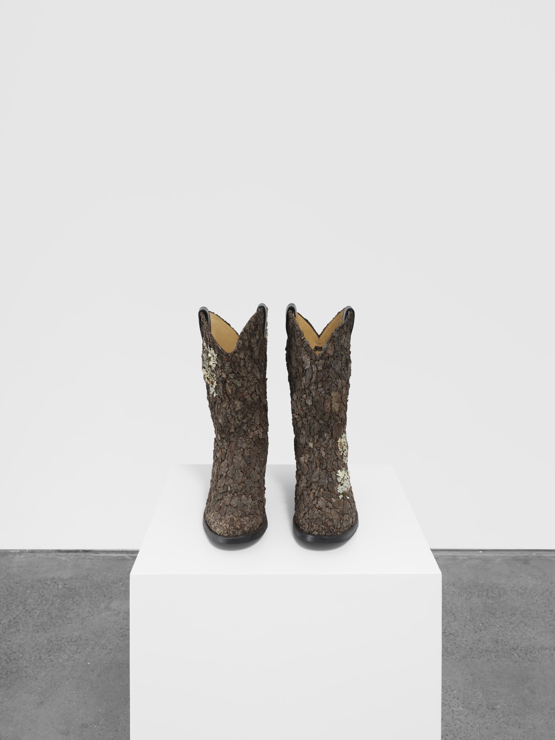 Hugh Hayden<br><em>Kansas</em>, 2024<br>Cowboy boots with tree bark<br>Each Boot: 14 x 13 x 5 inches / 35.6 x 33 x 12.7 cm