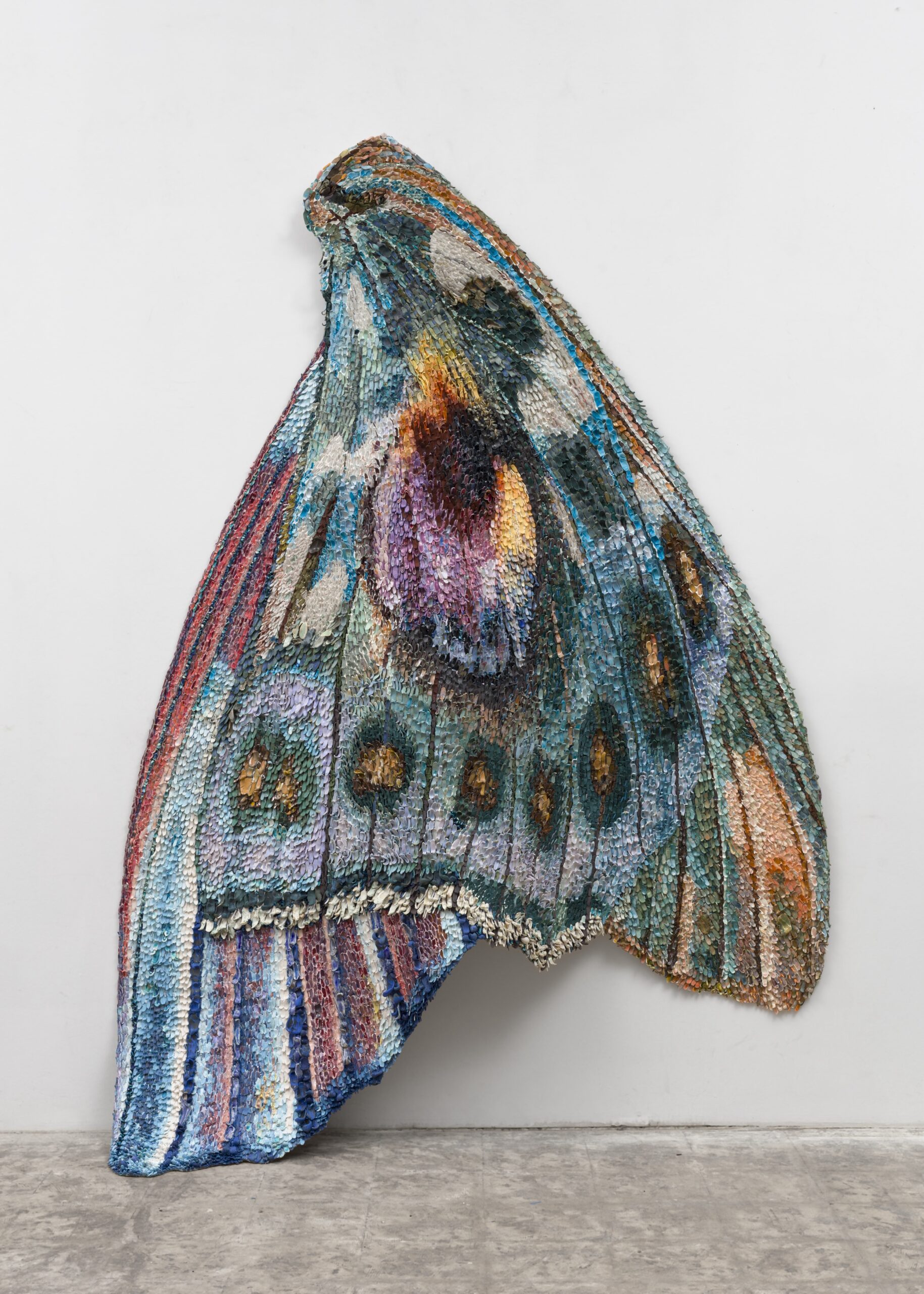 Rebecca Manson<br><em>Blue Peacock Wing</em>, 2026<br>Porcelain, glaze, adhesives, pigment, and hardware on canvas<br>95 x 70 x 12 inches / 241.3 x 177.8 x 30.5 cm