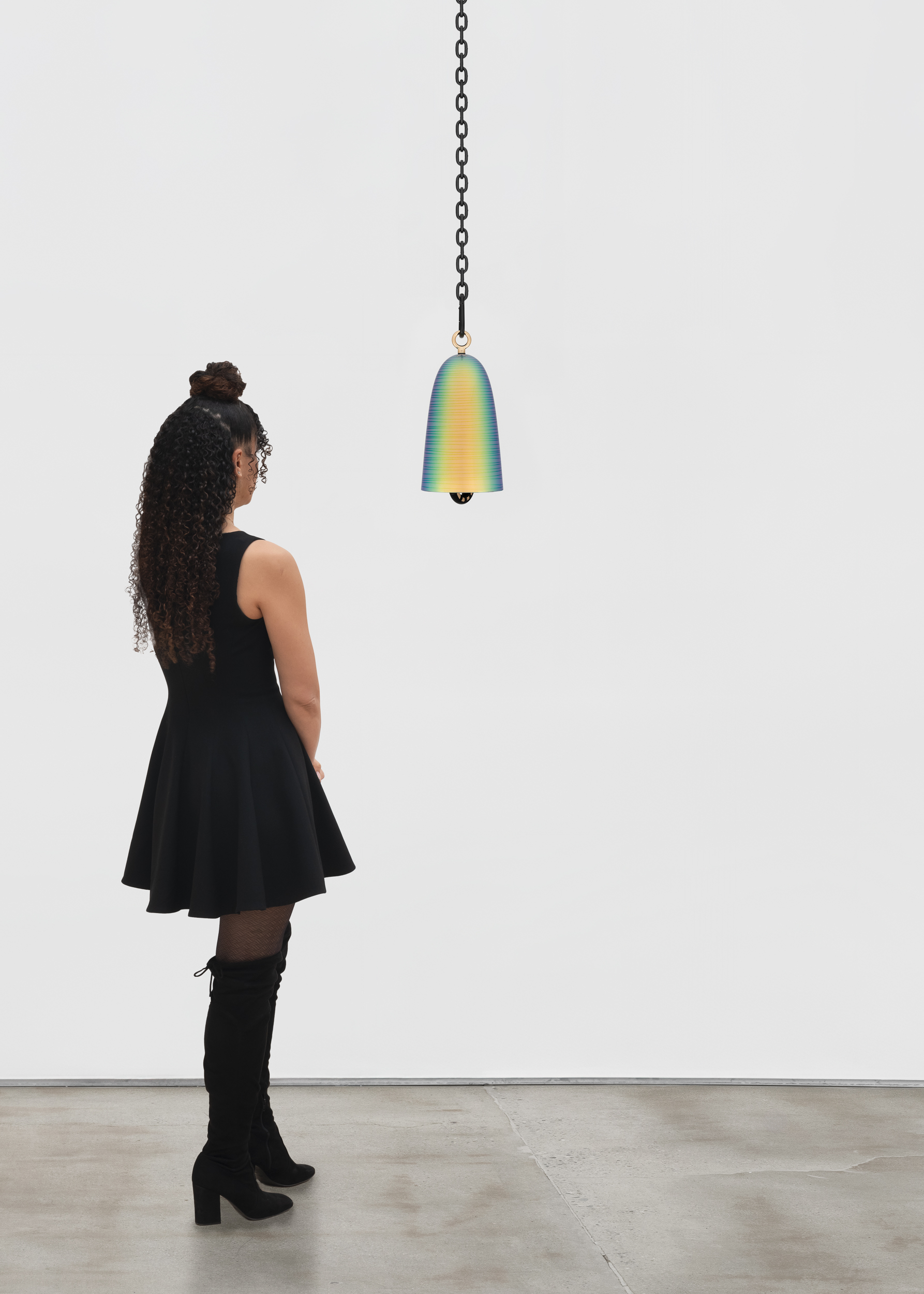 <p>Davina Semo<br />
<i>Mystic</i>, 2026<br />
Cast bronze bell, UV protected 3-stage catalyzed urethane automotive finish, polished solid bronze clapper with sleeve, hemp shibari rope, polished and plated stainless steel hardware, powder-coated stainless steel hardware, and powder-coated zinc-plated steel chain<br />
13 3/4 x 7 x 7 inches / 34.9 x 17.8 x 17.8 cm<br />
Overall hanging dimensions variable</p>
